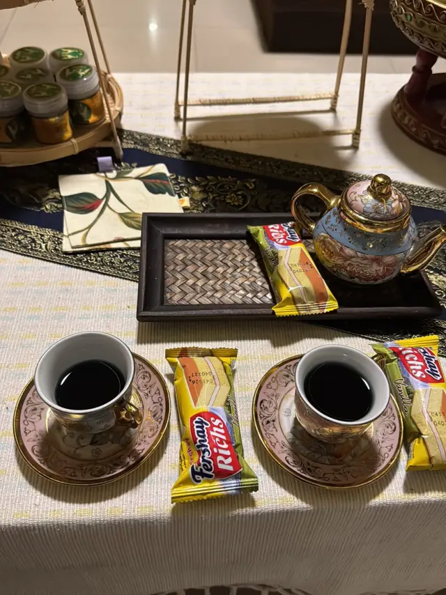 Two cups of coffee and wafer snacks on a tray at Ai Oon Massage Lanna, Chiang Mai